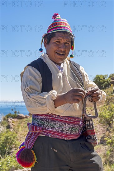 Native man knitting