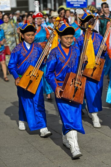 Youth in traditional Deel clothes and horse-head fiddle