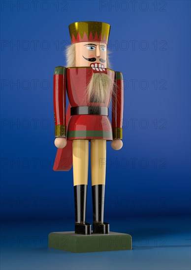 Nutcracker figure against a blue background