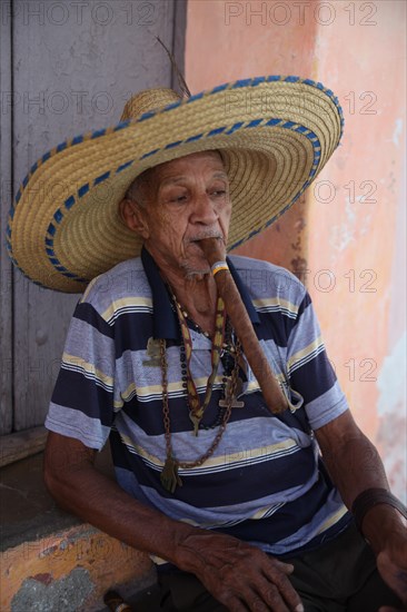 Old man smoking cigar