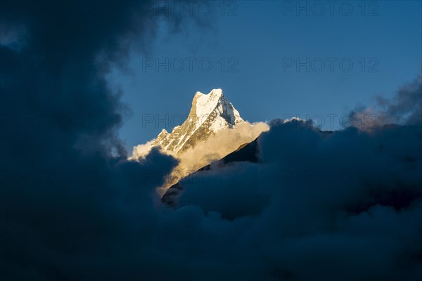 View on the summit of the mountain Machapuchare at sunset