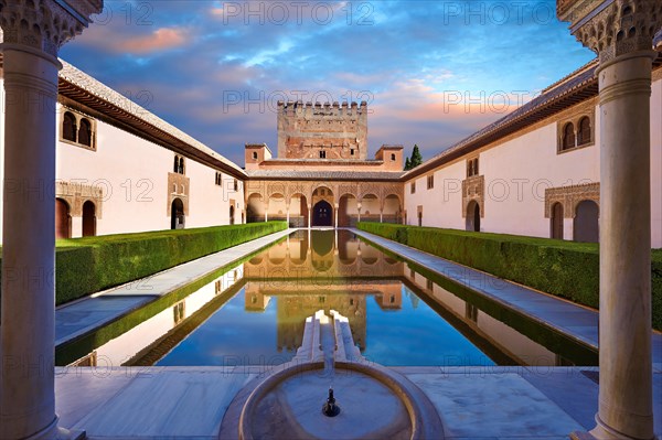 Arabesque Moorish architecture and pond of the Court of the Myrtles of the Palacios Nazaries