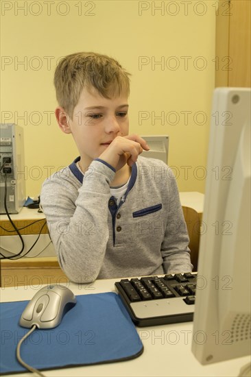 Elementary school student working in computer room