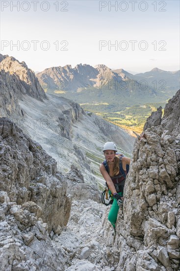 Hiker climbs the Santner via ferrata
