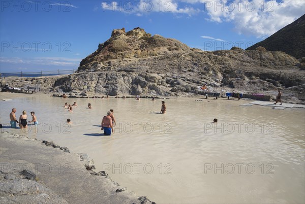 Bathers enjoying volcanic mud