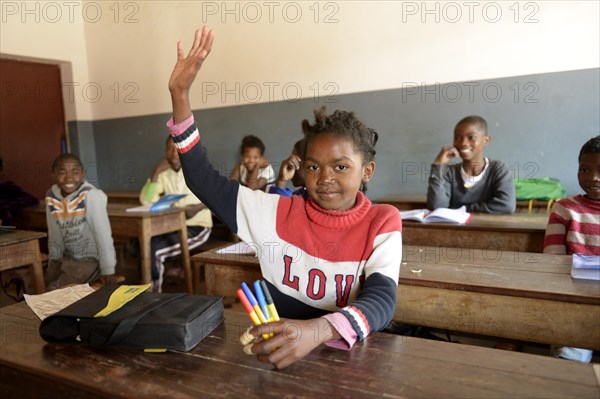 Girl with raised hand