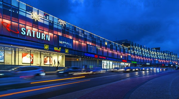 Evening lighting of a shopping centre at dusk