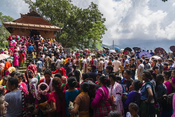 Local people waiting with roosters for sacrifice