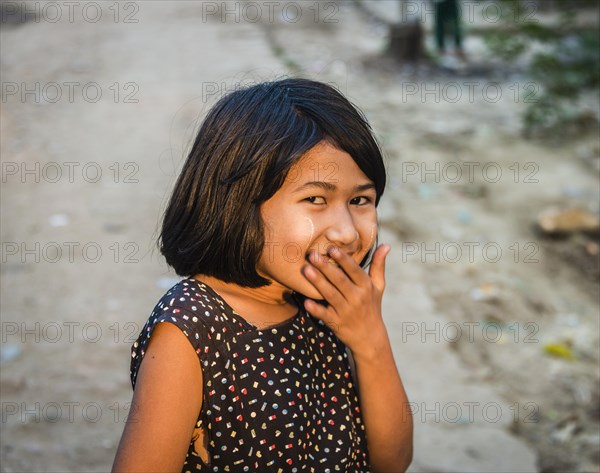 Little native girl smiling mischievously