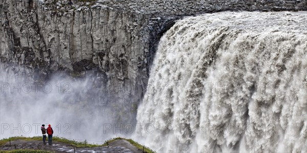 People at the waterfall Dettifoss