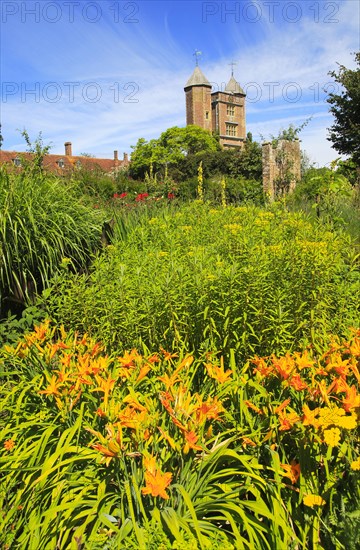 Flowers and red brick tower