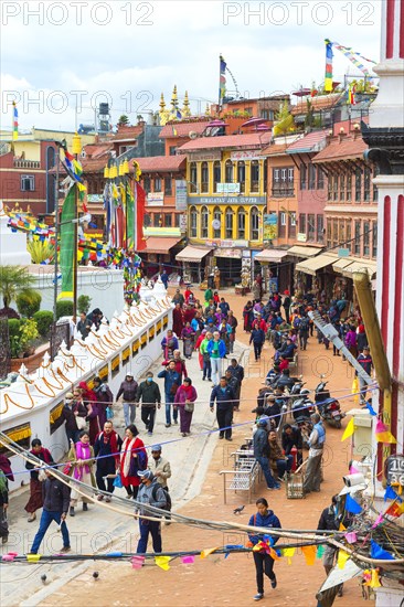 Buddhist pilgrims making the kora or ritual circumnavigation around the Boudhanath Stupa