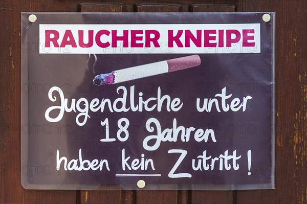 Sign for smoker pub at the entrance door