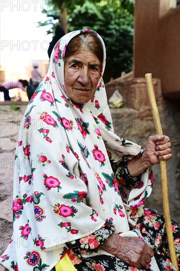 Old woman with tied chador