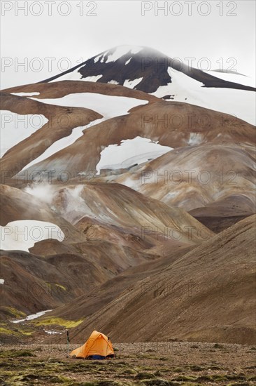 A tent on a snow-covered rhyolite mountain