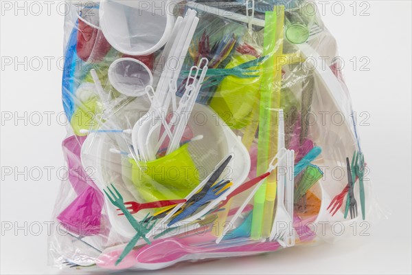 Garbage bag filled with disposable crockery