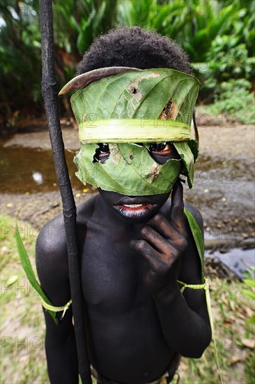 Korafe-child with facial and headdress made of leaves