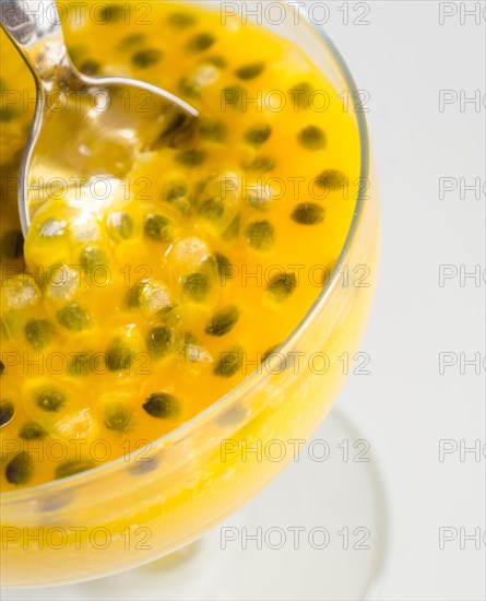 Passion fruit and mango mousse in dessert bowl