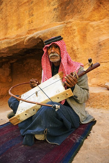 Old bedouin playing the one-string Lyra