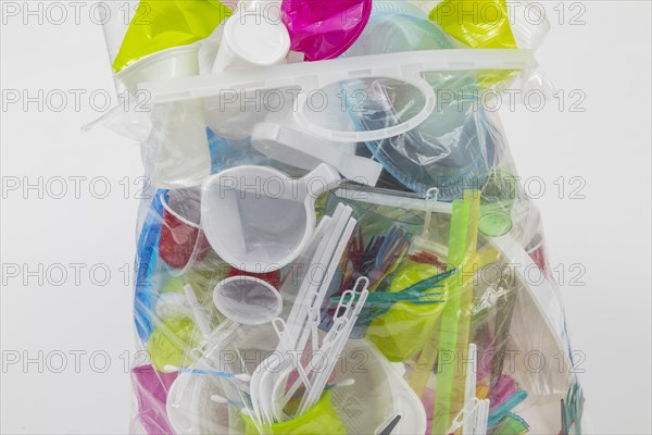 Garbage bag filled with disposable crockery