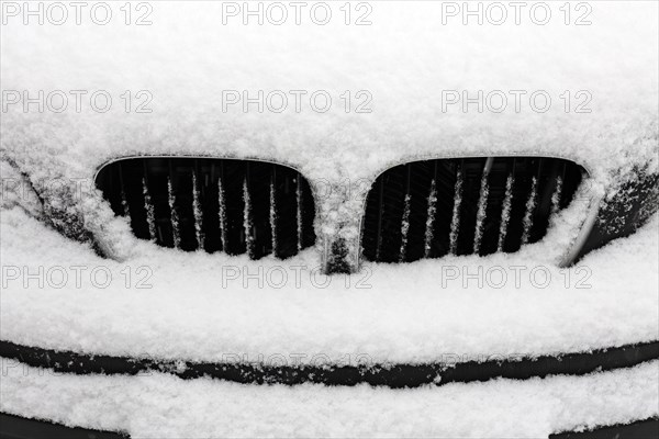 Radiator of a snow-covered BMW