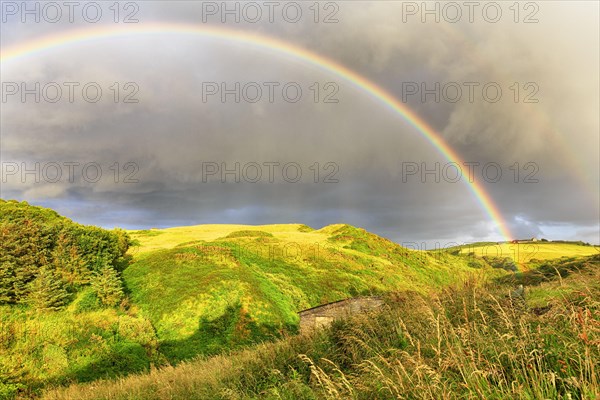 Double rainbow over landscape