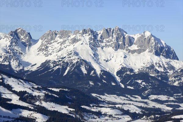 Snow-covered mountain massif Wilder Kaiser in winter with Ellmauer Tor