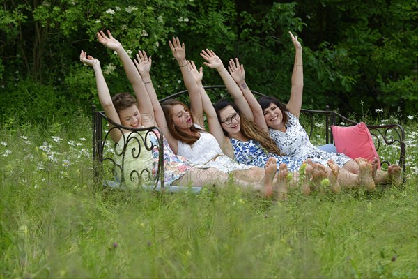 Young women sitting on sofa