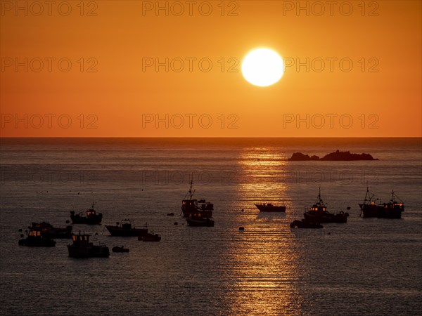 Fishing boats at sunset