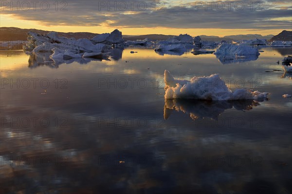 View over the icebergs at midnight sun