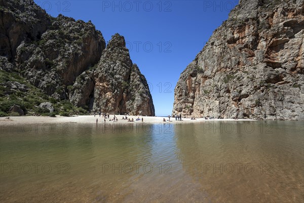 People on the beach in the gorge Torrent de Pareis