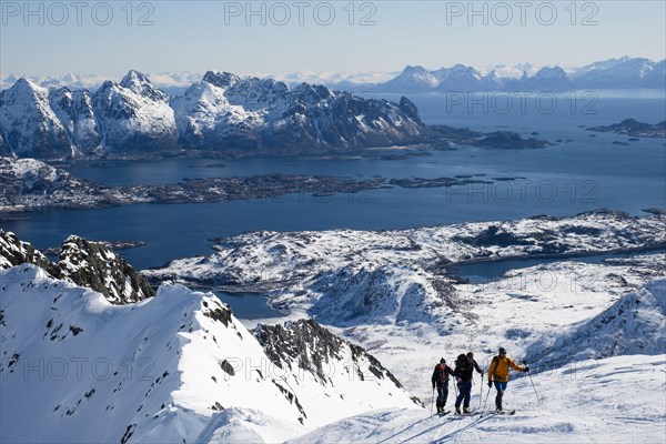 Ski mountaineers ascending to Rundfjellet