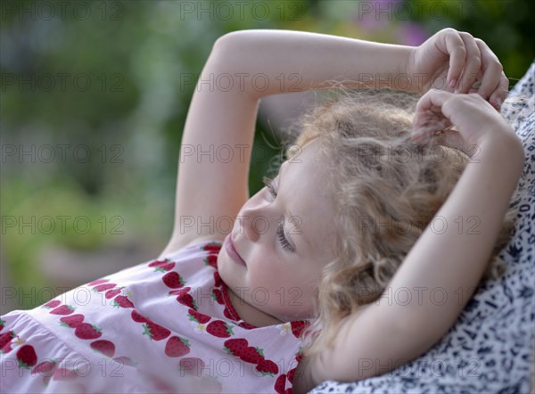 Young girl with blond curly hair