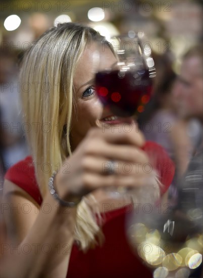 Woman celebrating with wine glass