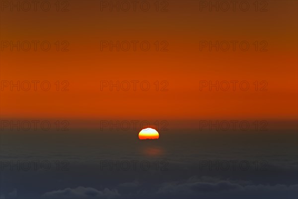 Sunrise over clouds