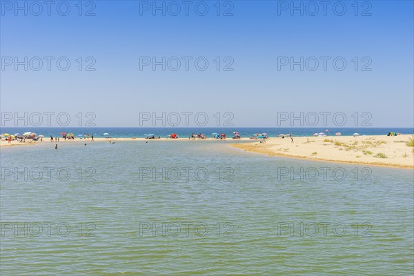 people relaxing on Salgados Beach between Albufeira and Armacao de Pera
