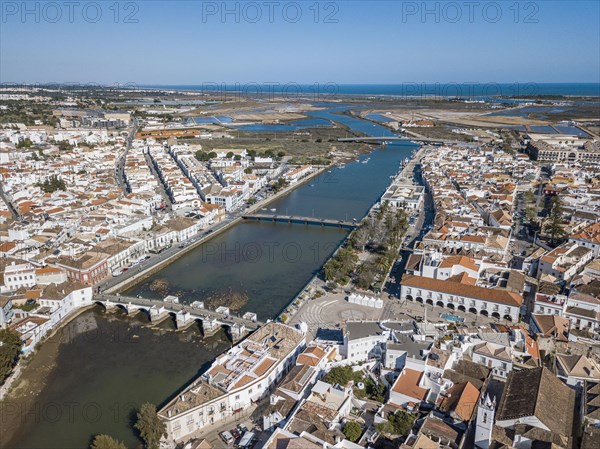 City view with roman bridge over Gilao river in old fishermen's town