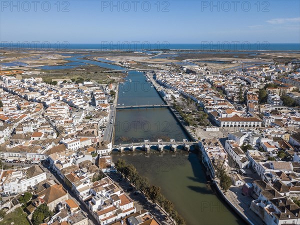 City view with roman bridge over Gilao river in old fishermen's town