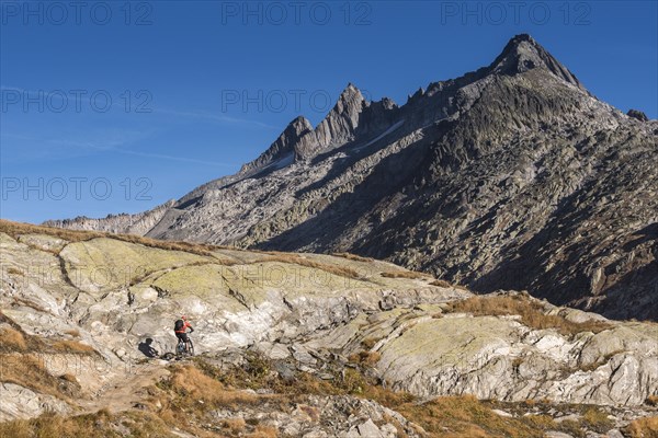 Mountain biker on the pass summit