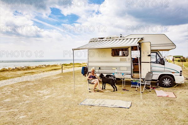 Woman sitting with a dog