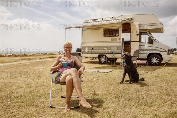 Woman sitting with a dog