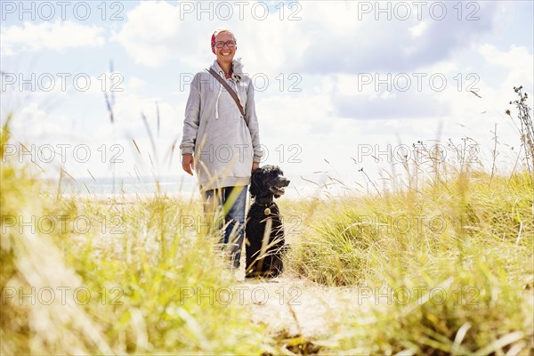 Woman walks with her dog