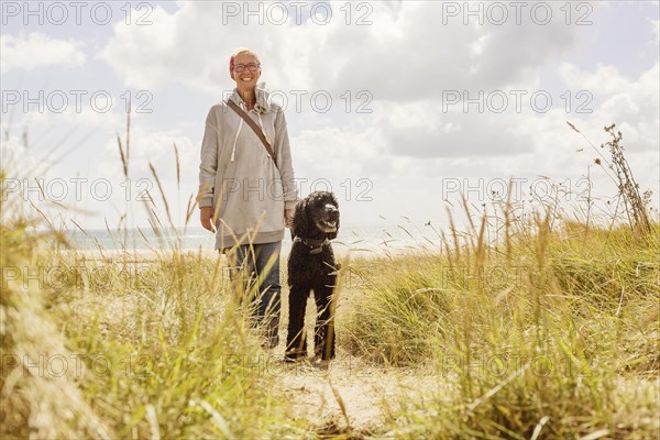 Woman walks with her dog