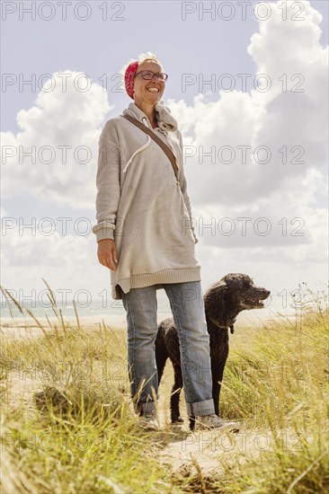 Woman walks with her dog