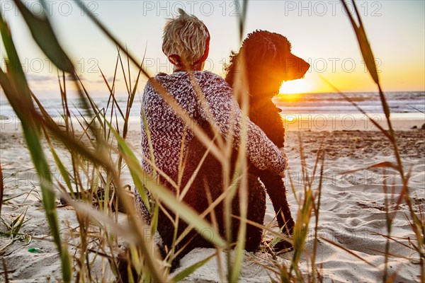 Woman sitting with her dog