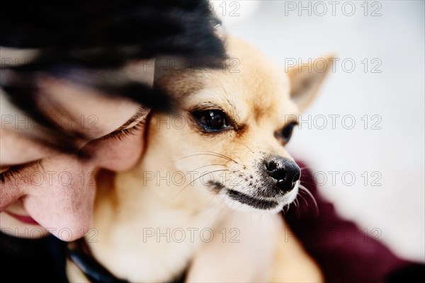 Woman caresses her dog