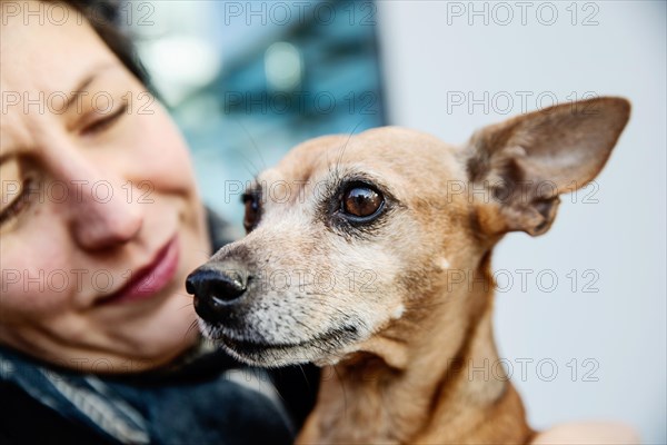 Laughing woman with her dog