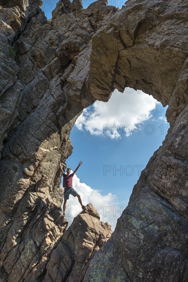 Young man standing in the bomb crater