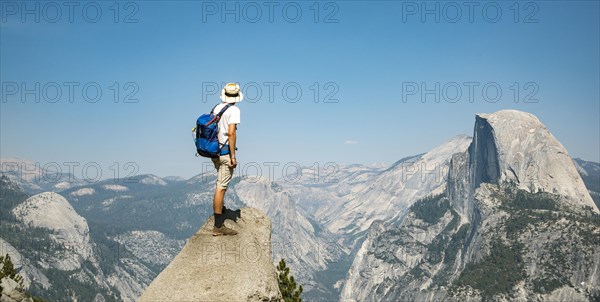 Young man standing on ledge