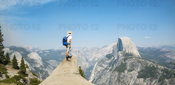 Young man standing on ledge